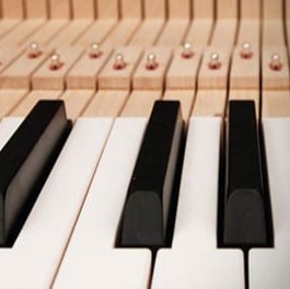 close up of acoustic upright piano keys