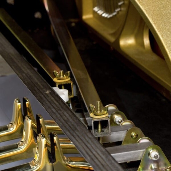 square pedal levers that  link piano pedals to the piano action