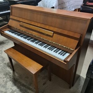 Kawai CE-7N small upright piano in a walnut finish.